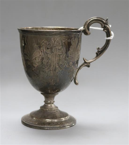 A Victorian engraved silver pedestal christening mug, Daniel & Charles Houle, London, 1863,